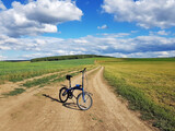 Bike on a country road in a field