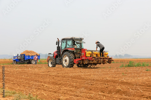 Tractors grow corn in no-tillage operations, Luannan County, Hebei Province, China © zhang yongxin