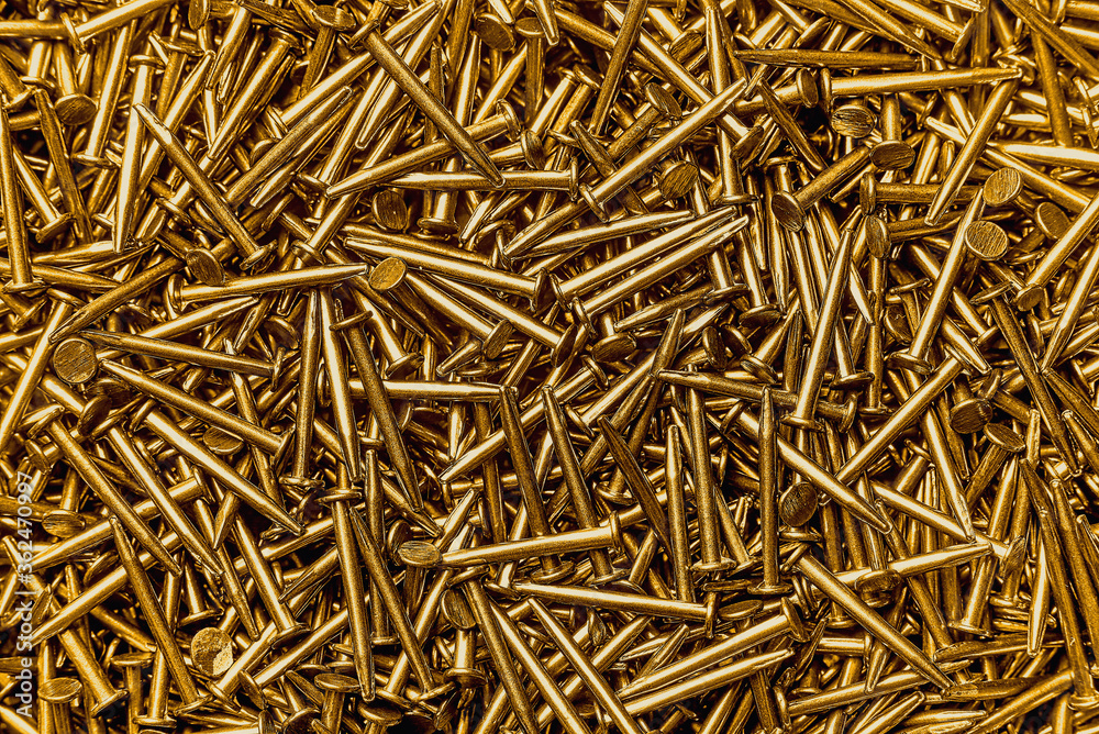 gold colored metal nails macro flat lay background gold colored metal nails macro flat lay background