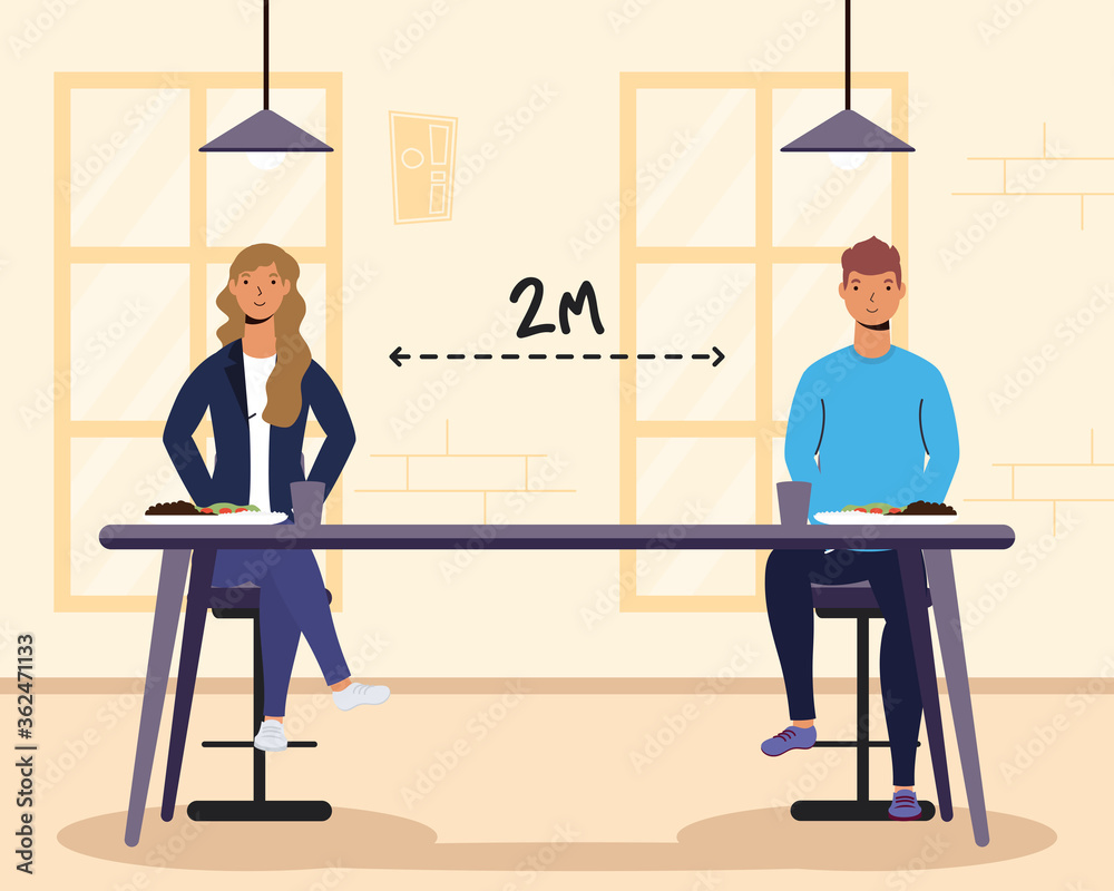 Fototapeta premium young couple dinning in restaurant practicing social distancing ,covid19 prevention method