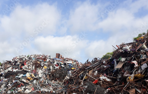 A pile of scrap metal and many antiques in an antique store