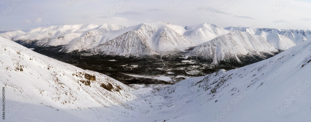 mountain valley in winter under snow, hibiny, russia