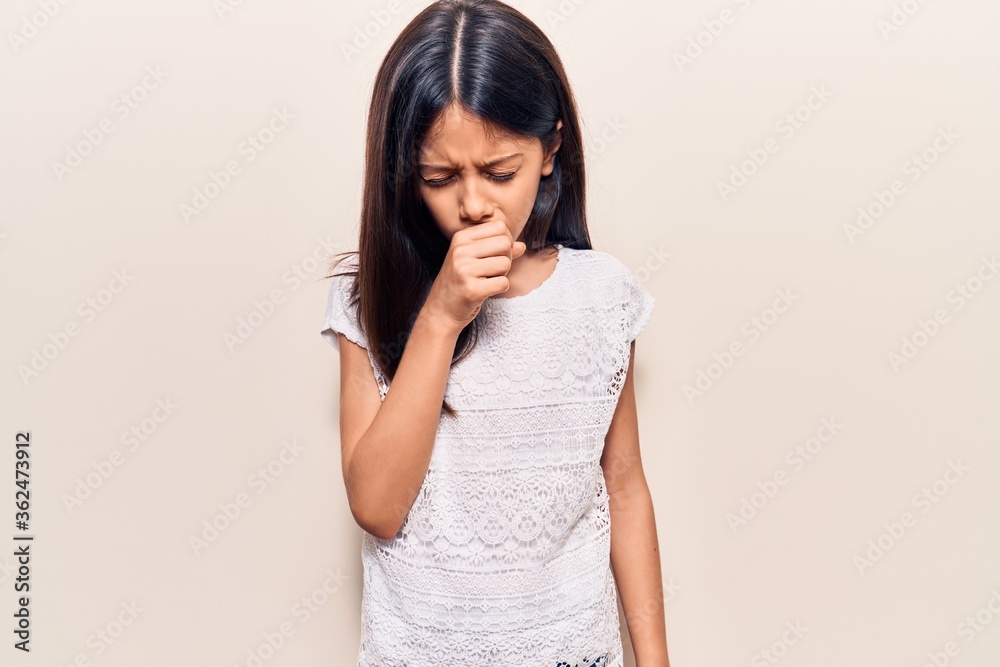 Beautiful child girl wearing casual clothes smiling happy and positive, thumb up doing excellent and approval sign Beautiful child girl wearing casual clothes smiling happy and positive, thumb up doing excellent and approval sign