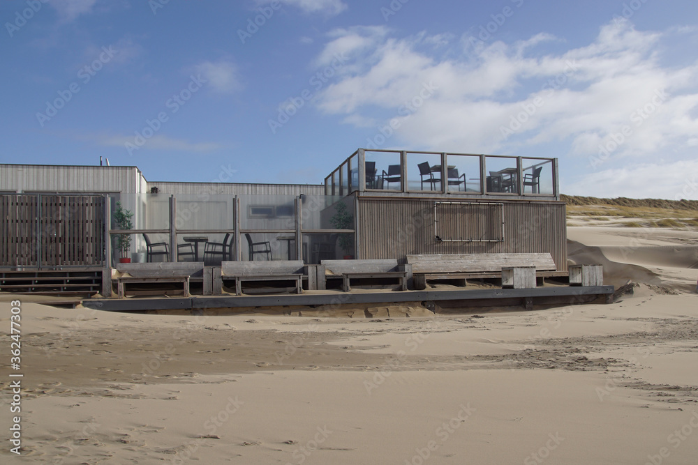 Abandoned beach pavilion in the Netherlands in the sand of the beach at the North Sea. Bergen aan zee, Netherlands, March Abandoned beach pavilion in the Netherlands in the sand of the beach at the North Sea. Bergen aan zee, Netherlands, March