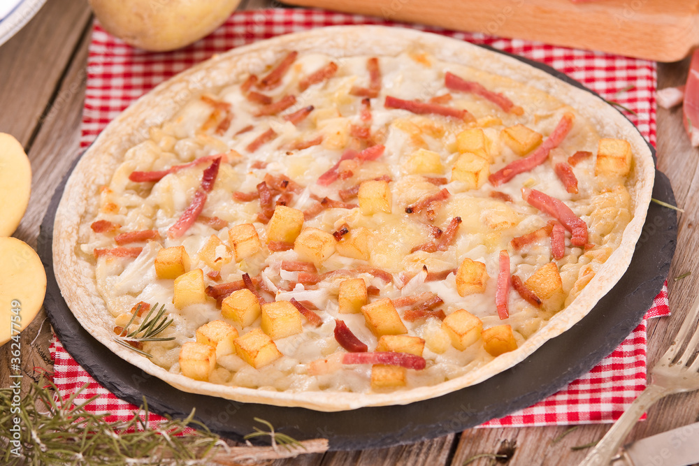 Tart with fried potato, raclette cheese and smoke flavour bacon.
Tart with fried potato, raclette cheese and smoke flavour bacon.