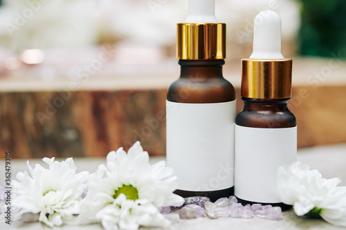 Close-up image of small bottles with serums and oils for spa procedures