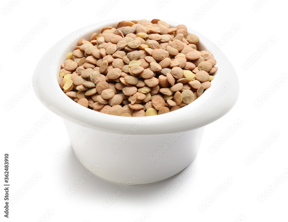 Raw lentils in bowl on white background Raw lentils in bowl on white background