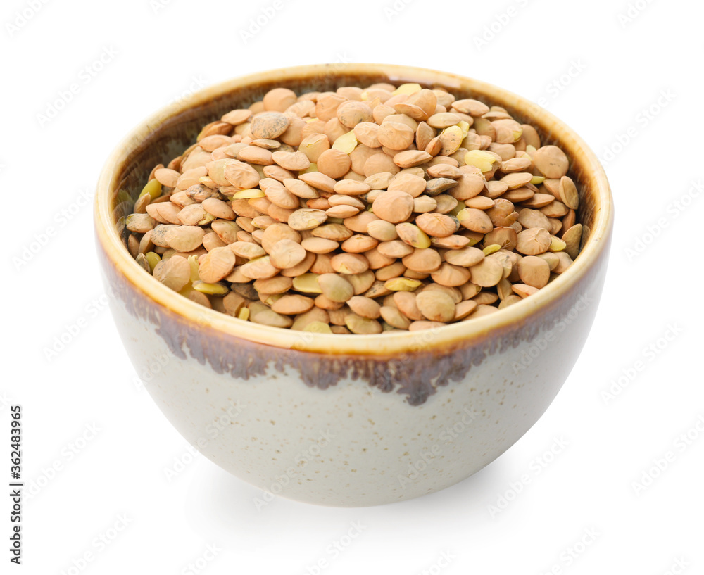 Raw lentils in bowl on white background Raw lentils in bowl on white background
