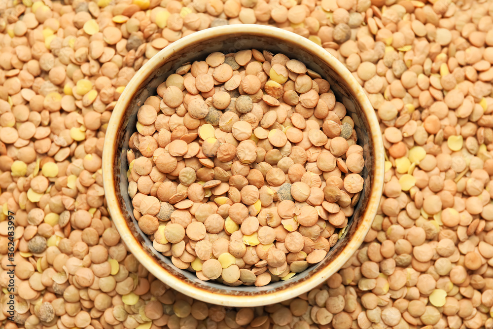 Bowl on raw lentils, top view