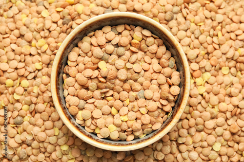 Bowl on raw lentils, top view