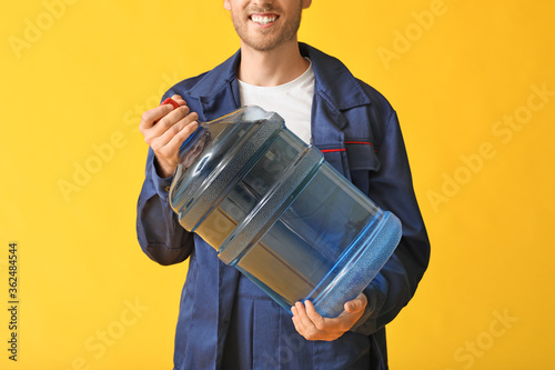 Delivery man with bottle of...