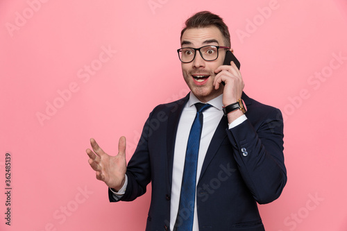 happy elegant man in suit talking on the phone © Viorel Sima