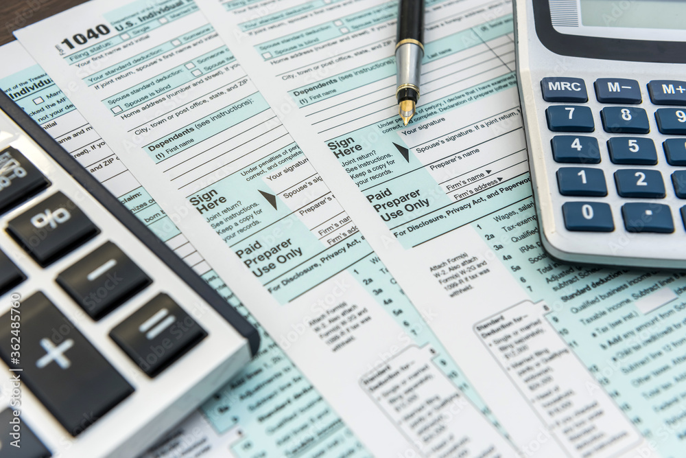 Tax Forms with Calculator and Pen. Financial accounting Tax Forms with Calculator and Pen. Financial accounting