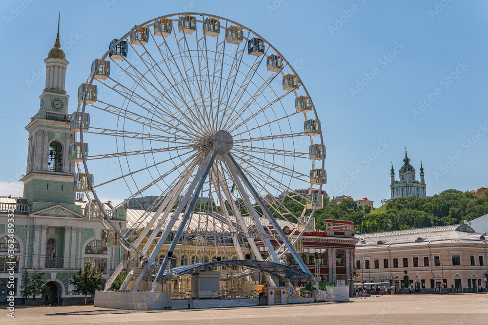 Kyiv (Kiev), Ukraine - July 05, 2020: A big and beautiful sight wheel in the center of historical region and tourist area