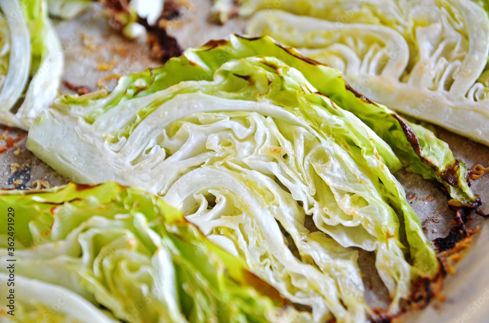 Obraz premium Baked young cabbage on baking paper