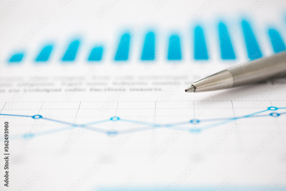 Financial statistics documents ball pen infographics at office table closeup. Internal Revenue Service inspector sum check, investigation, exchange market, earnings, savings, loan and credit concept Financial statistics documents ball pen infographics at office table closeup. Internal Revenue Service inspector sum check, investigation, exchange market, earnings, savings, loan and credit concept