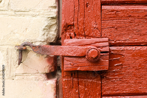 Photos Aged wooden door with old rustic ironmongery, shackle, hasp & staple