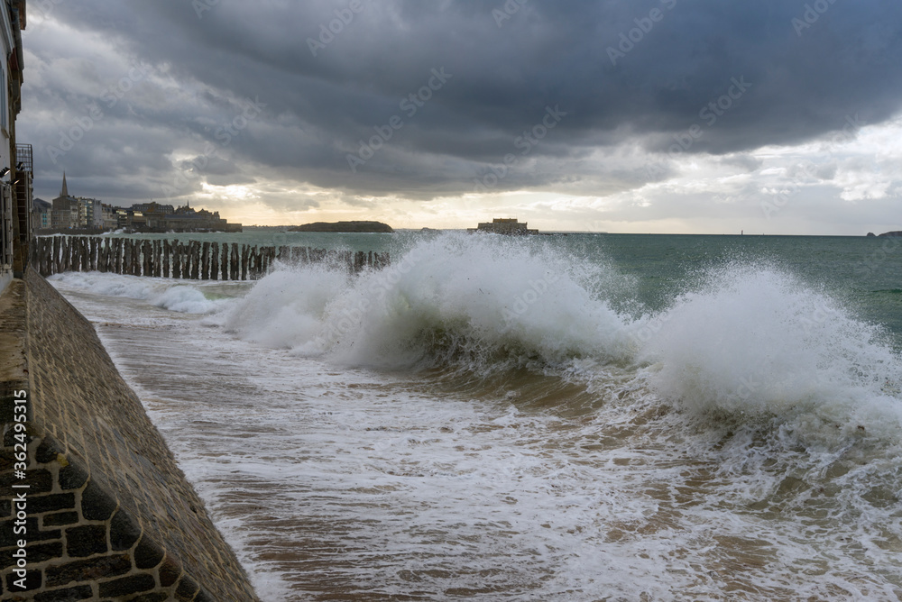 Big high tide and big waves on the Chaussée du Sillon in Saint Malo, Brittany, France Big high tide and big waves on the Chaussée du Sillon in Saint Malo, Brittany, France