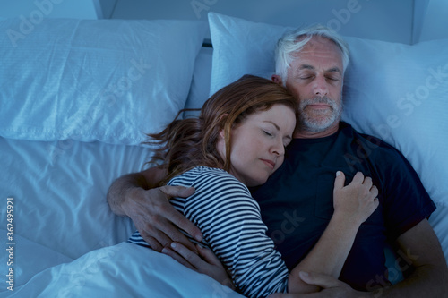 Obraz na płótnie Mature couple sleeping at night