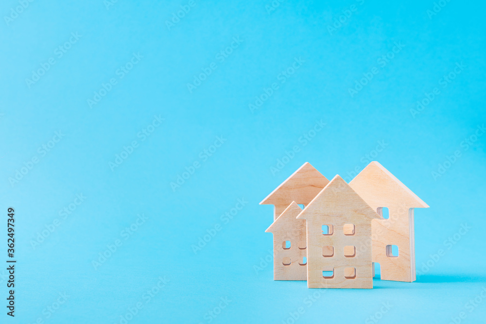 Art design picture of nice wooden figures new settlement cottage hotel investment rate development residence isolated over bright vivid shine vibrant blue color background Art design picture of nice wooden figures new settlement cottage hotel investment rate development residence isolated over bright vivid shine vibrant blue color background