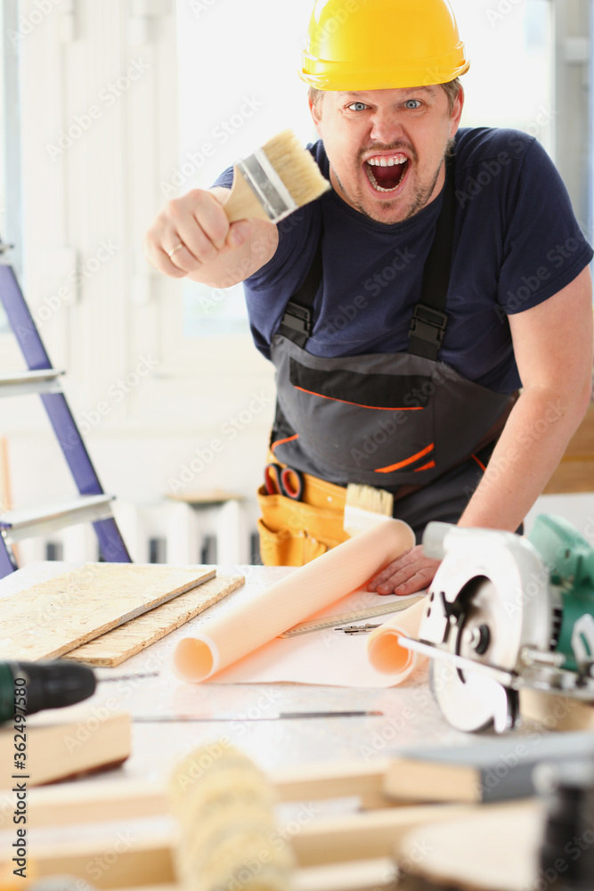Arm of smiling worker hold brush portrait. Manual job workplace, DIY inspiration, improvement, fix shop, yellow helmet, hard hat, joinery startup idea, industrial education, profession career concept Arm of smiling worker hold brush portrait. Manual job workplace, DIY inspiration, improvement, fix shop, yellow helmet, hard hat, joinery startup idea, industrial education, profession career concept