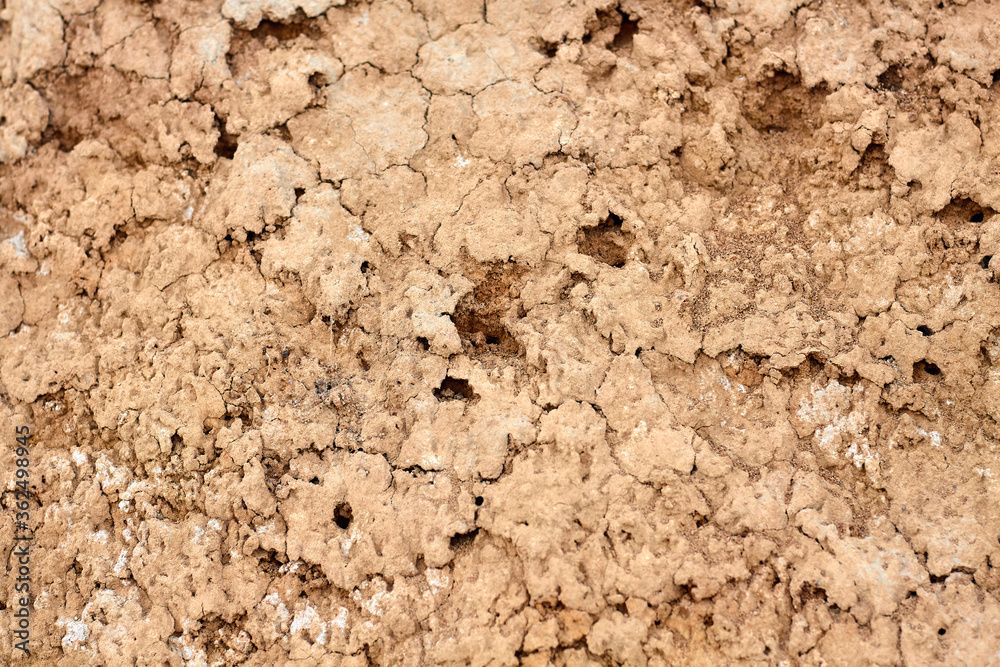 Texture of different layers of clay on the edge of a cliff. Closeup Texture of different layers of clay on the edge of a cliff. Closeup
