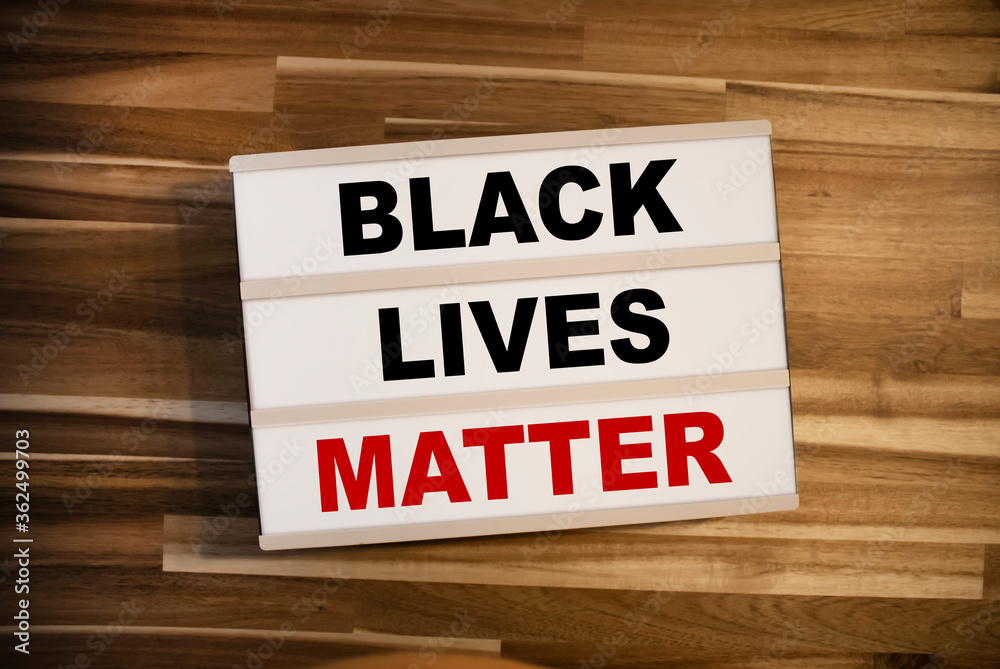 Light box or lightbox with message Black Lives Matter on a wooden table background Light box or lightbox with message Black Lives Matter on a wooden table background