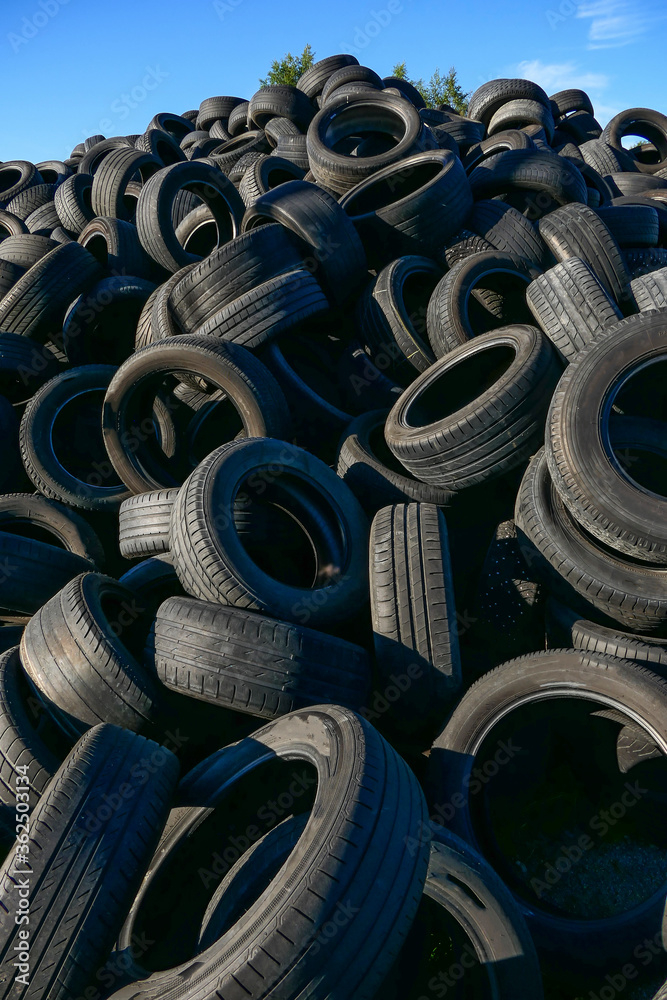 Fototapeta premium Haparanda, Sweden June 17, 2020 A stack of used automotive tires. no logo