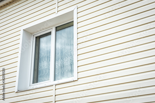 Vinyl siding and windows on new house construction.