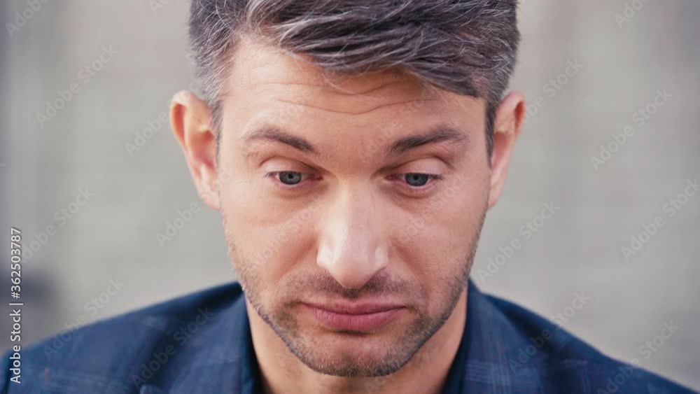 tired man taking off glasses and touching eyes outside tired man taking off glasses and touching eyes outside