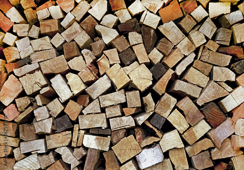 Abstract background (texture) of dry firewood in a pile for furnace kindling.