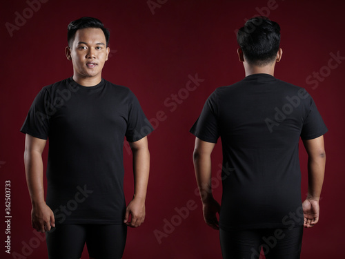 Front and rear portrait of a young man. Young male in blank black t-shirt, front and back view, isolated red background with clipping path. Design men tshirt template and mockup for print.