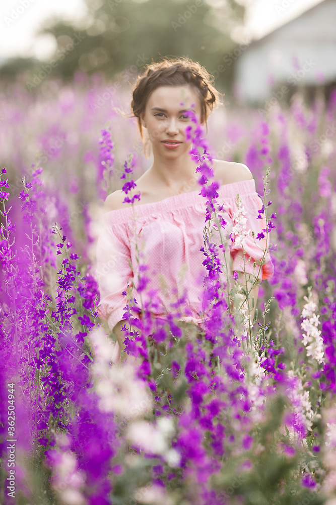 Very beautiful young woman with flowers. Close up portrait of attractive female Very beautiful young woman with flowers. Close up portrait of attractive female