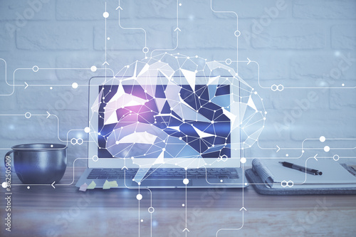 Multi exposure of work table with computer and brain hologram. Brainstorm concept.