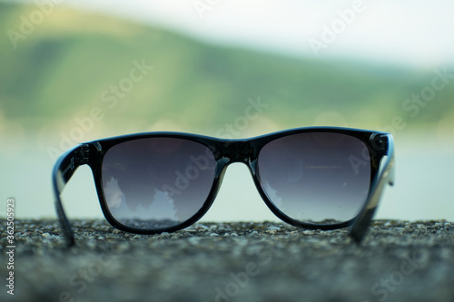 Black sunglasses. Concept- sunny days