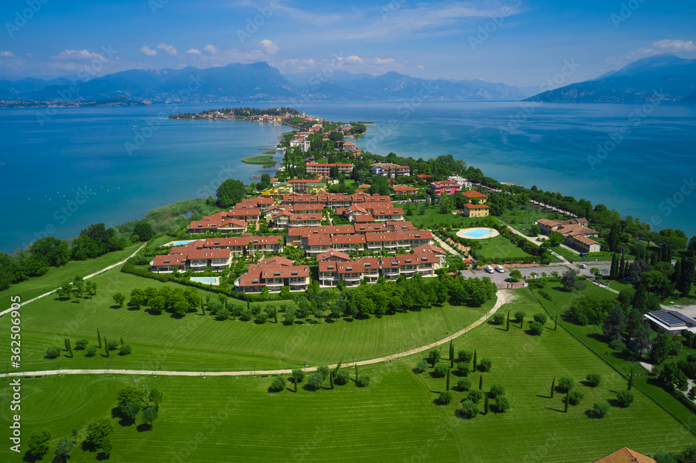 San Vito park, aerial view of Sirmione, Colombare, Lake Garda, Italy. In the background the blue sky and the magnificent Alps