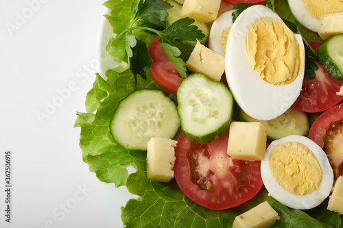 healthy food, cabbage salad with tomatoes, egg and cheese.