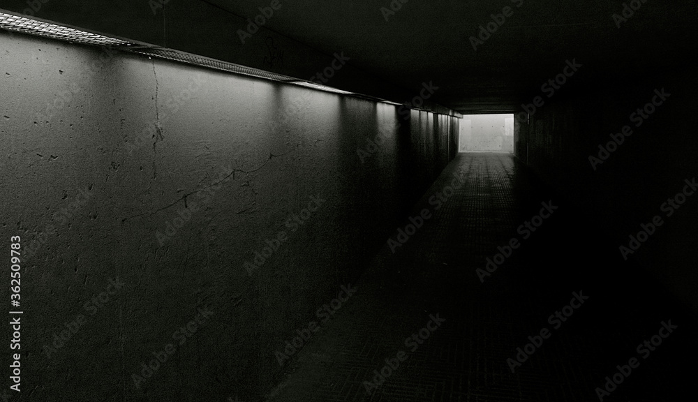 Dark interior of a subway with exit to the street