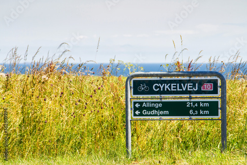 Obraz na plátně Cycling sign with direction, Bornholm, Denmark