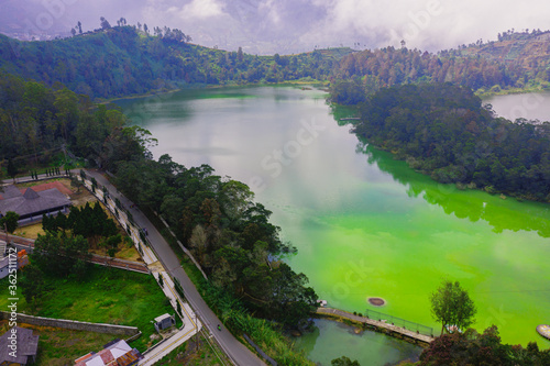 Aerial view of a Colour Lake (Telaga Warna) Dieng (Wonosobo) on a sunny day. photo