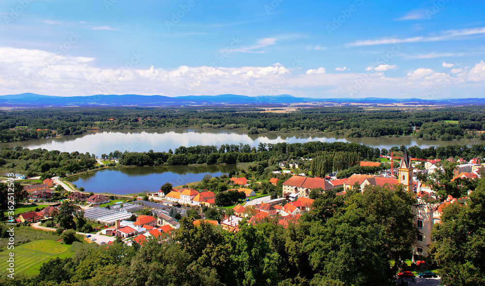 Picturesque aerial view at the famous Czech town Hluboka nad Vltavou from the castle on the blue sky background. - obrazy, fototapety, plakaty 