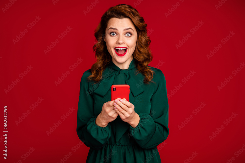 Close-up portrait of her she nice attractive gorgeous addicted cheerful cheery wavy-haired girl using cell app 5g isolated on bright vivid shine vibrant red maroon burgundy marsala color background Close-up portrait of her she nice attractive gorgeous addicted cheerful cheery wavy-haired girl using cell app 5g isolated on bright vivid shine vibrant red maroon burgundy marsala color background