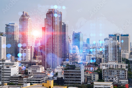 World planet Earth map hologram over panorama city view of Bangkok  Asia. The concept of international connections and business. Multi Exposure.