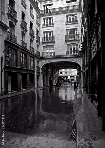 Street in black and white while it rains