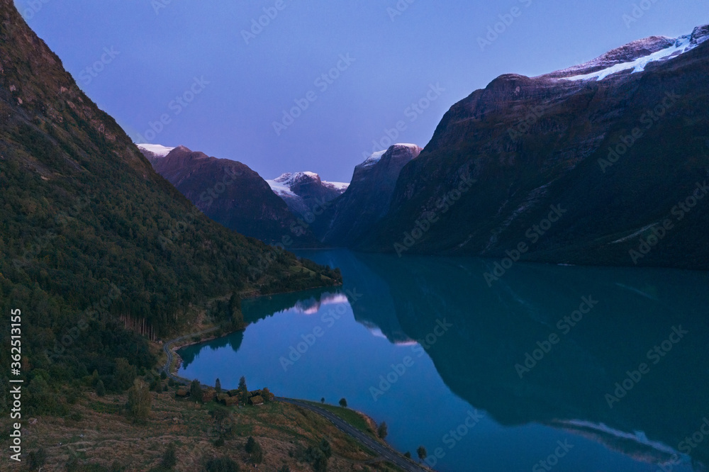 Lovatnet lake and mountains in Norway aerial view water reflection night landscape travel scenery scandinavian beautiful destinations.