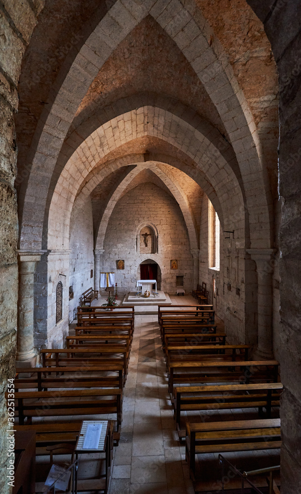 Interior of a medieval church with the altar in the background