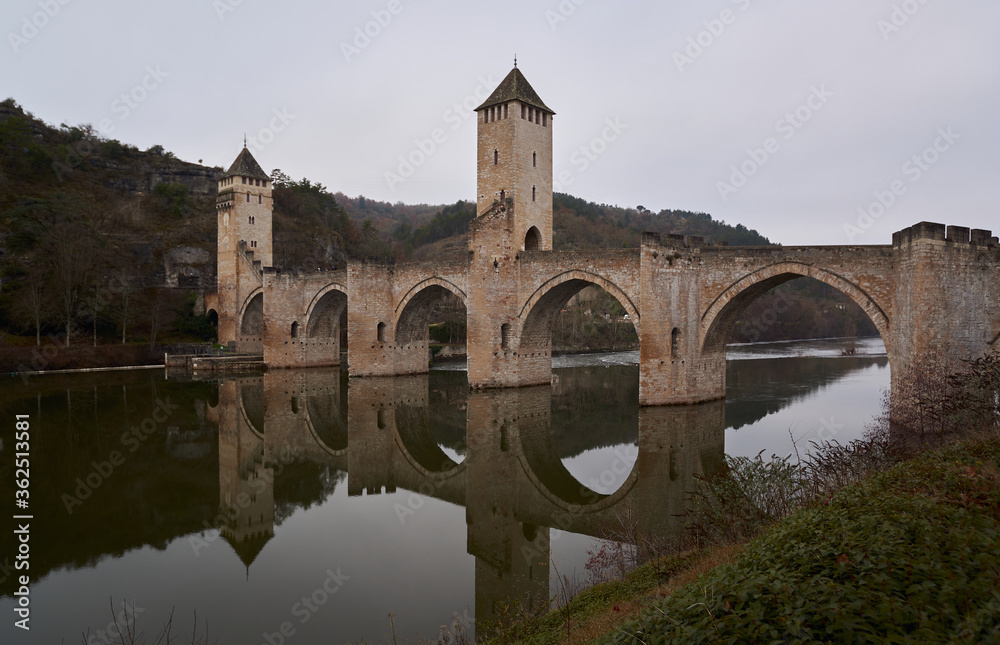 Medieval bridge across the river lot