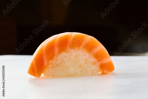 Classic sushi with salmon on white background. Traditional Japanese cuisine