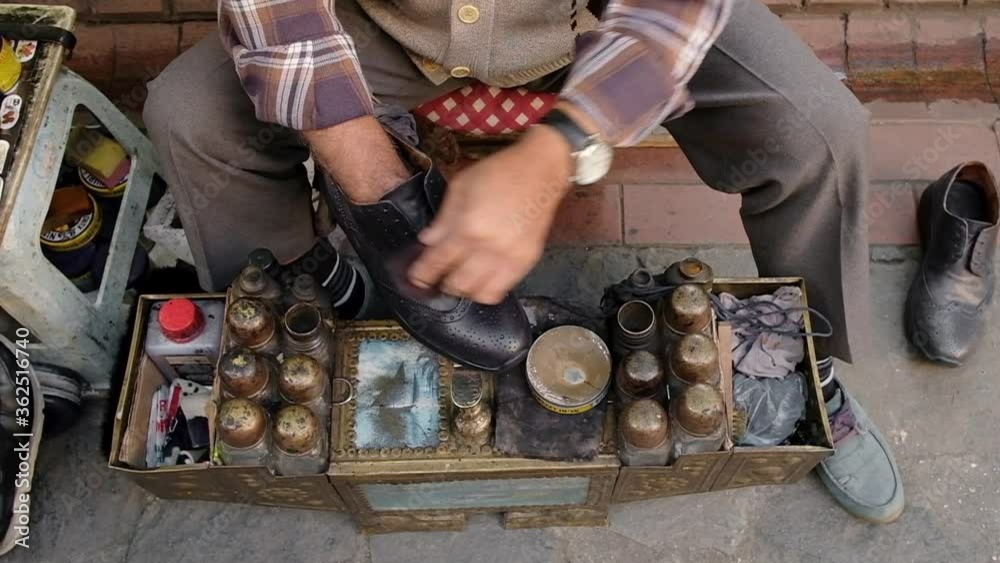 Shoe cleaner working on the street in Bursa, Turkey.