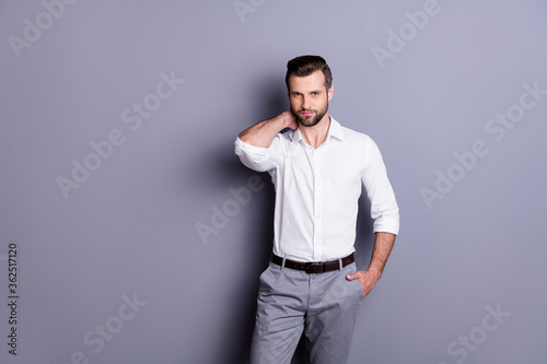 Portrait of charming attractive marketer ceo man touch neck enjoy working day wear good look clothes isolated over gray color background